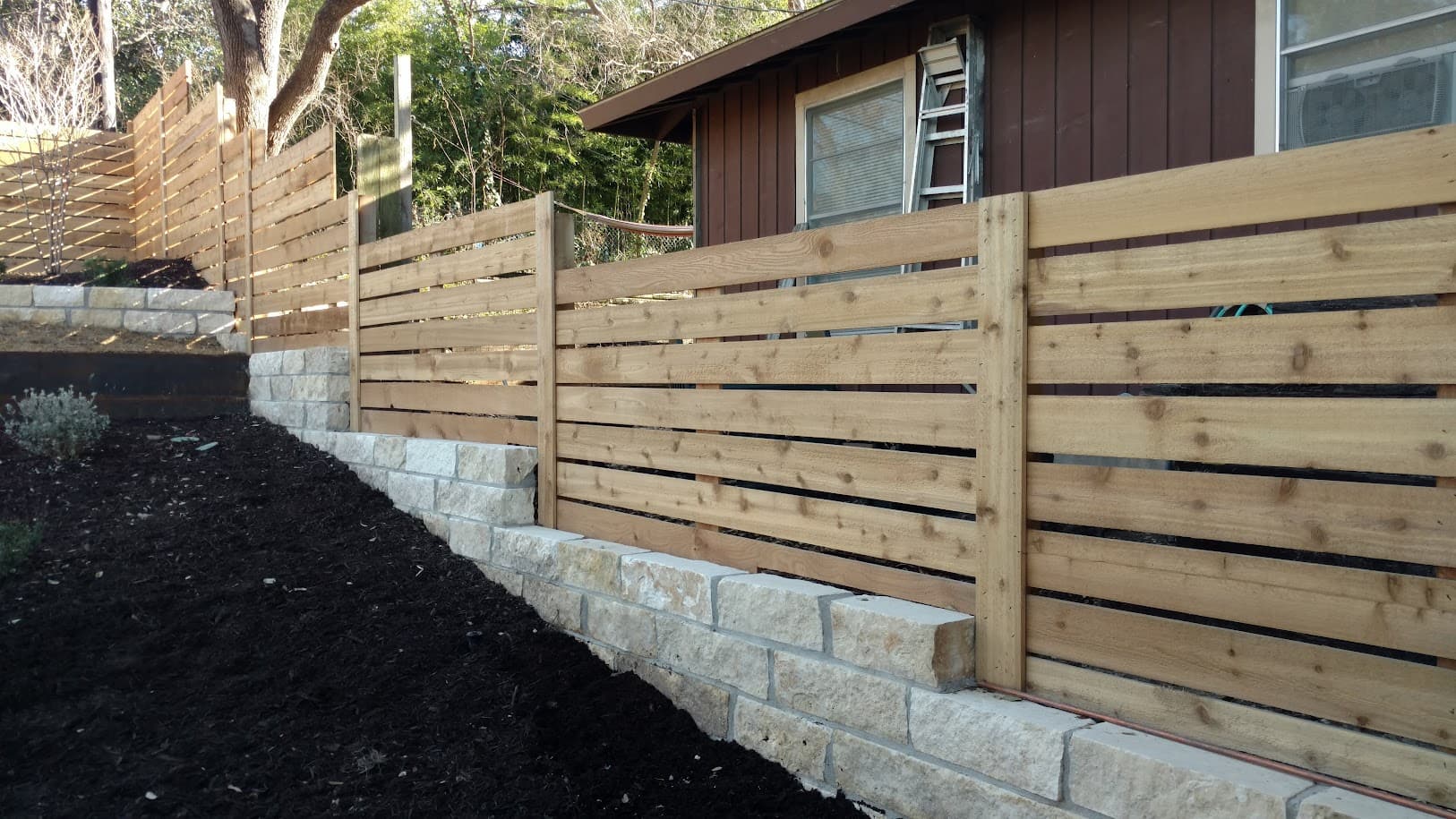 Kellison project, custom steel fencing and gate installation with landscape integration