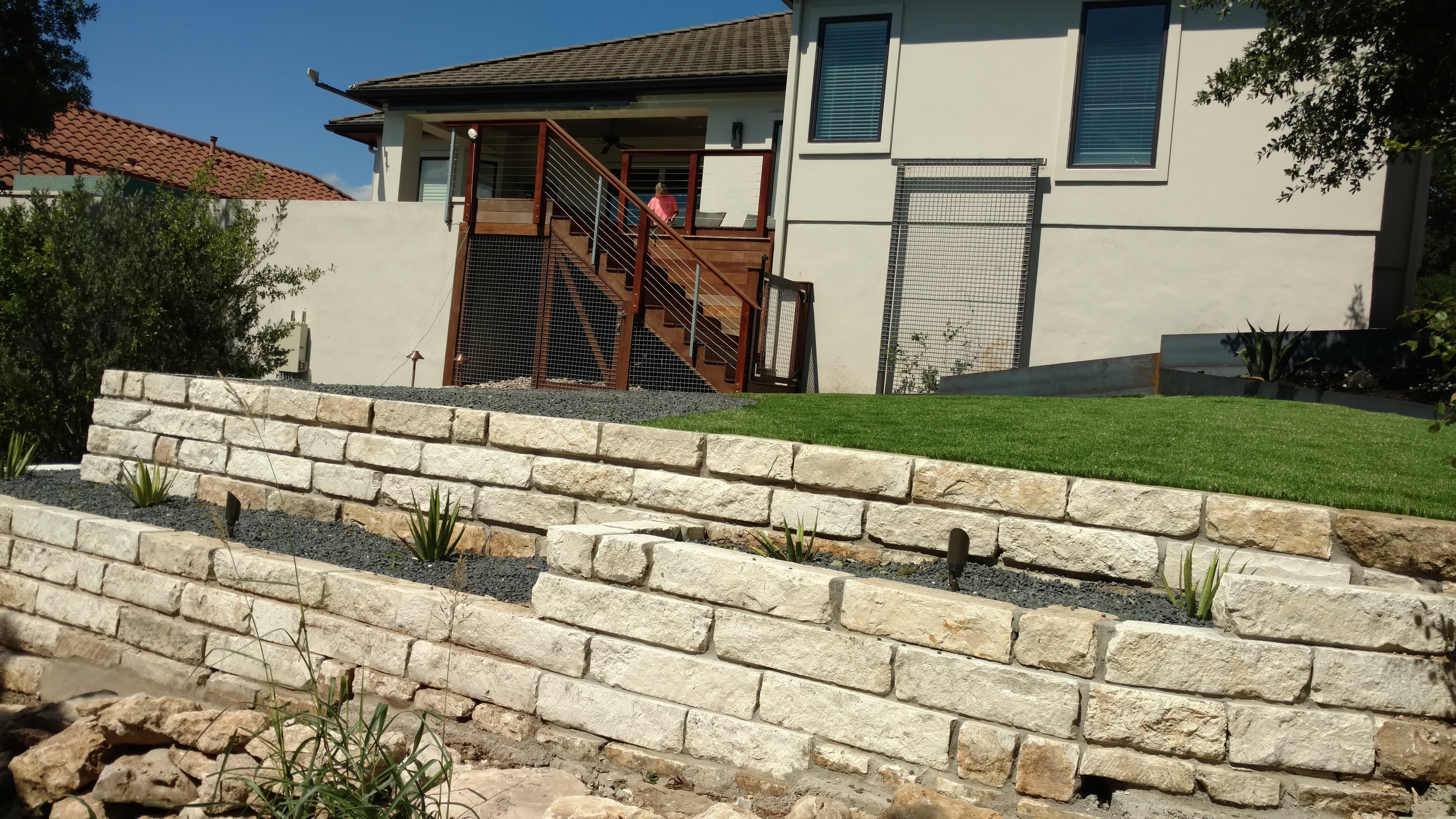 Two tiered limestone retaining wall Austin