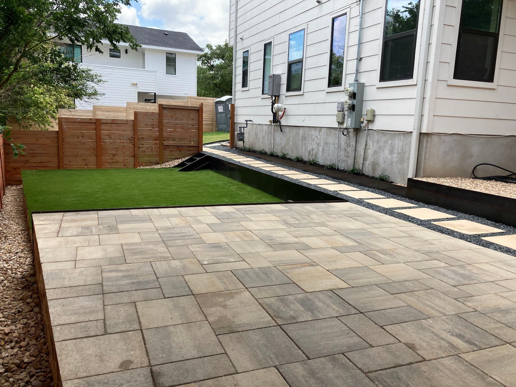 Modern backyard hardscape Austin